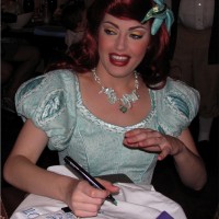 Ariel signing the pillow case