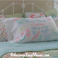 Disney character autographs on a pillow case