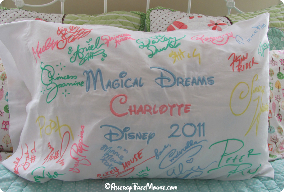 Disney character autographs on a pillow